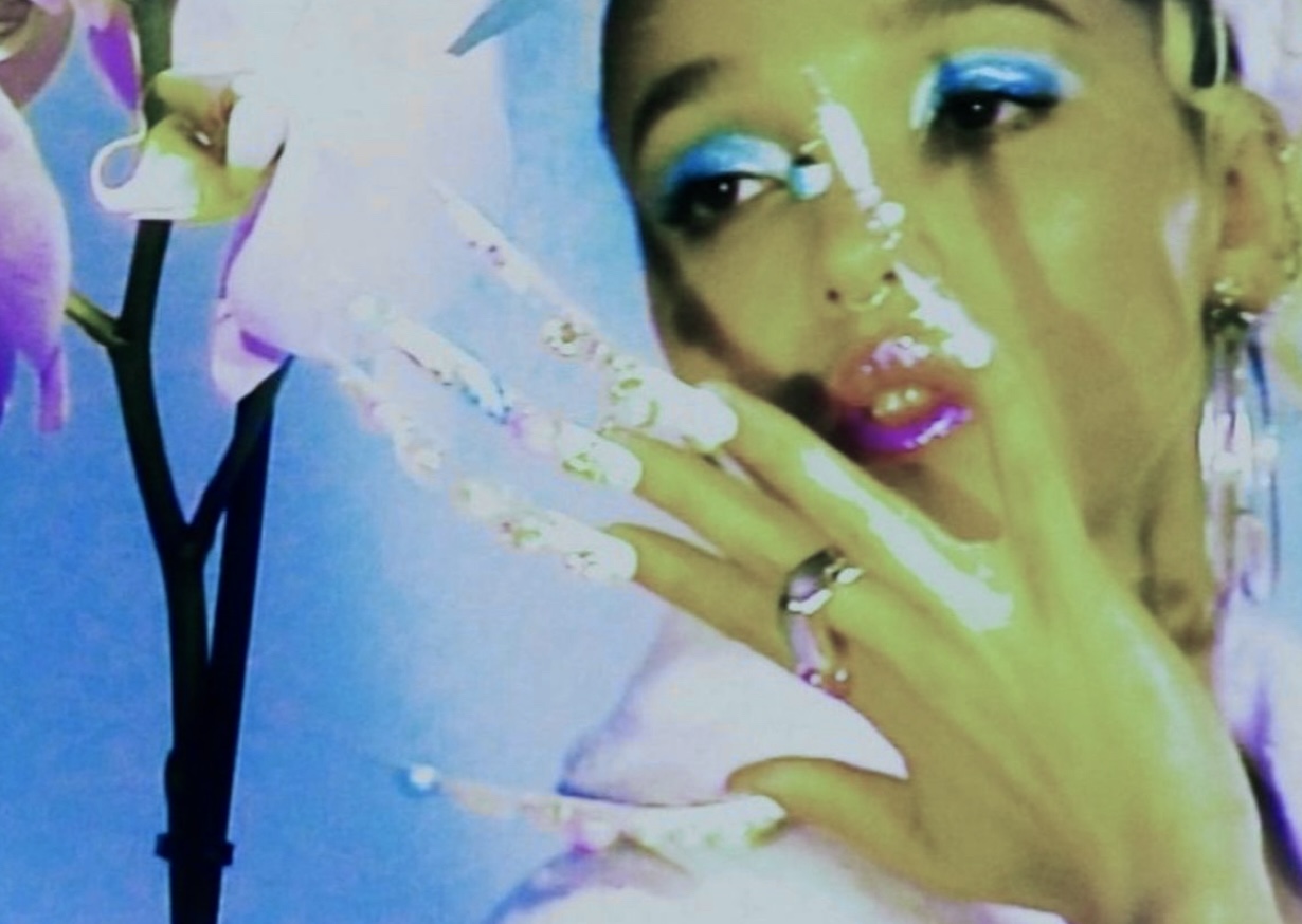 FKA Twigs with super long nails and colourful makeup oh my love music video