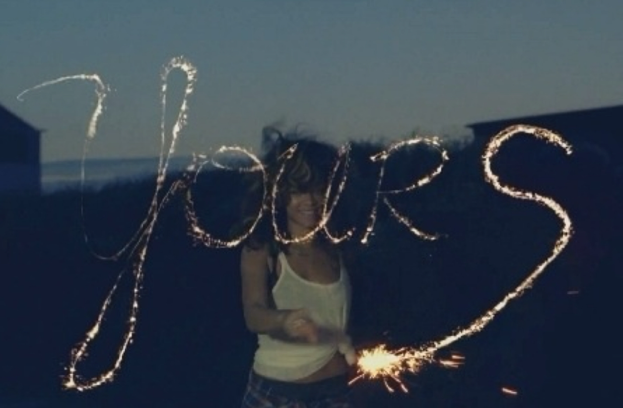 Rihanna writing yours with sparkler We Found Love music video